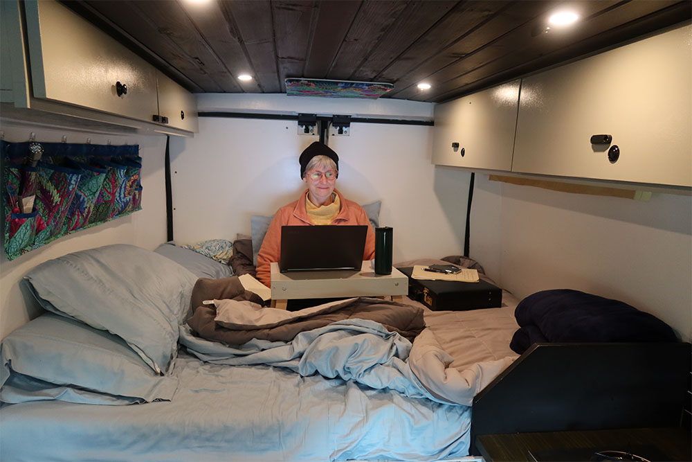 Mary at work in the campervan